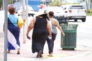 Three obese ladies walking and contemplating bariatric surgery and eating disorders