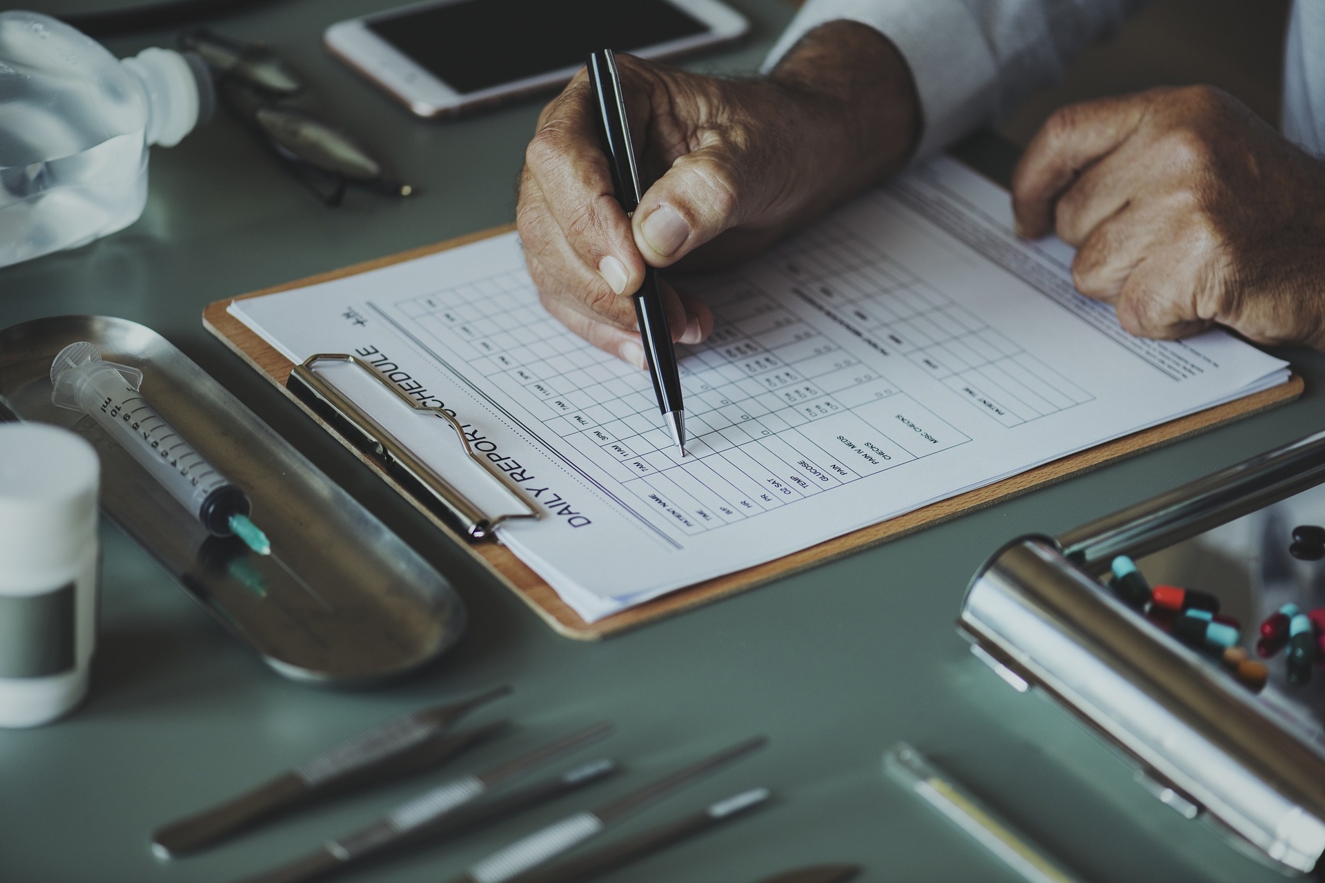 Doctor Filling Out Form | Weight Hope